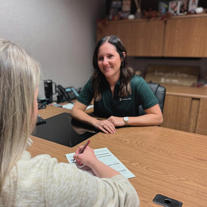 Courtney helping a customer