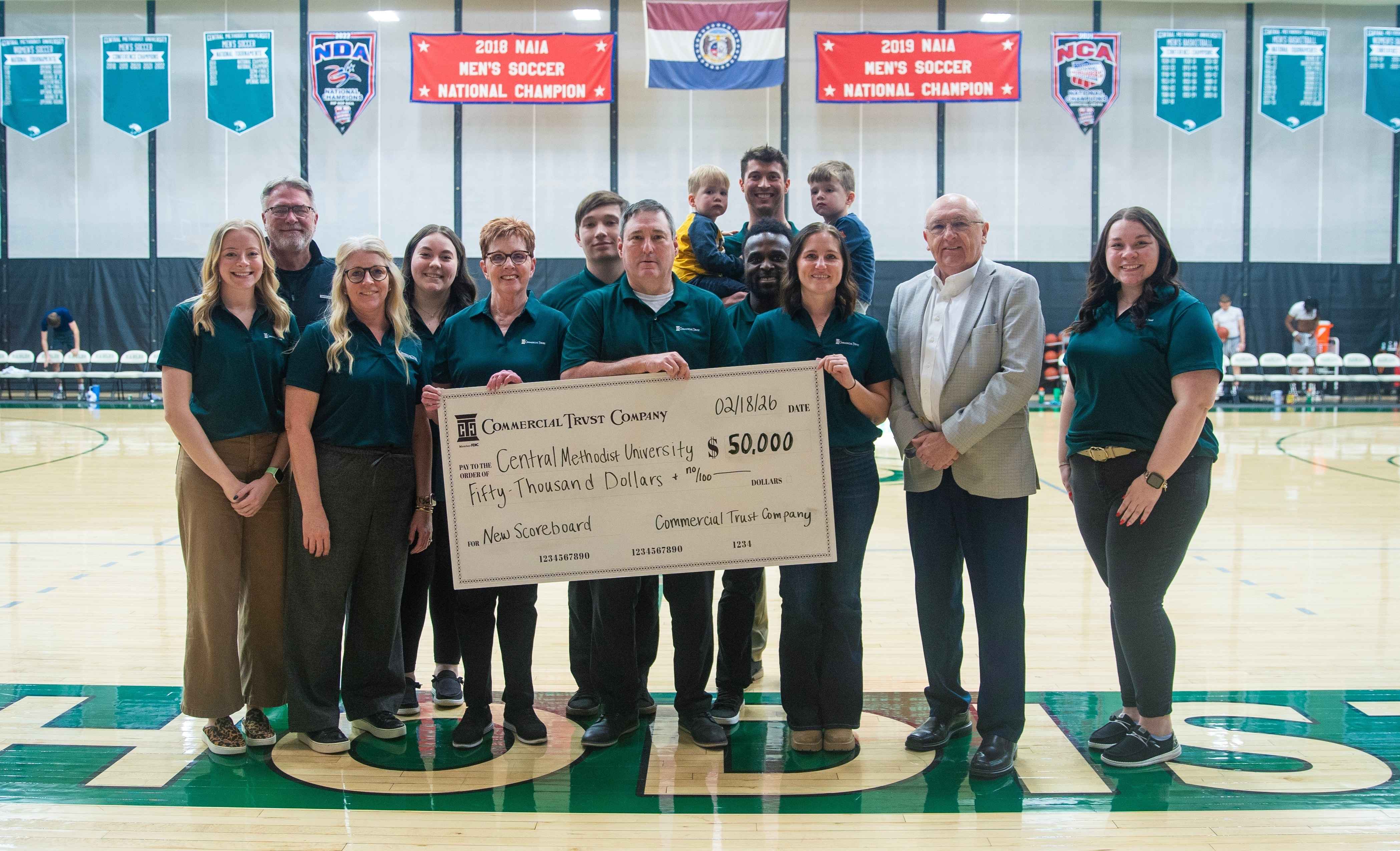 CTC at CMU presenting the $50,000 check.